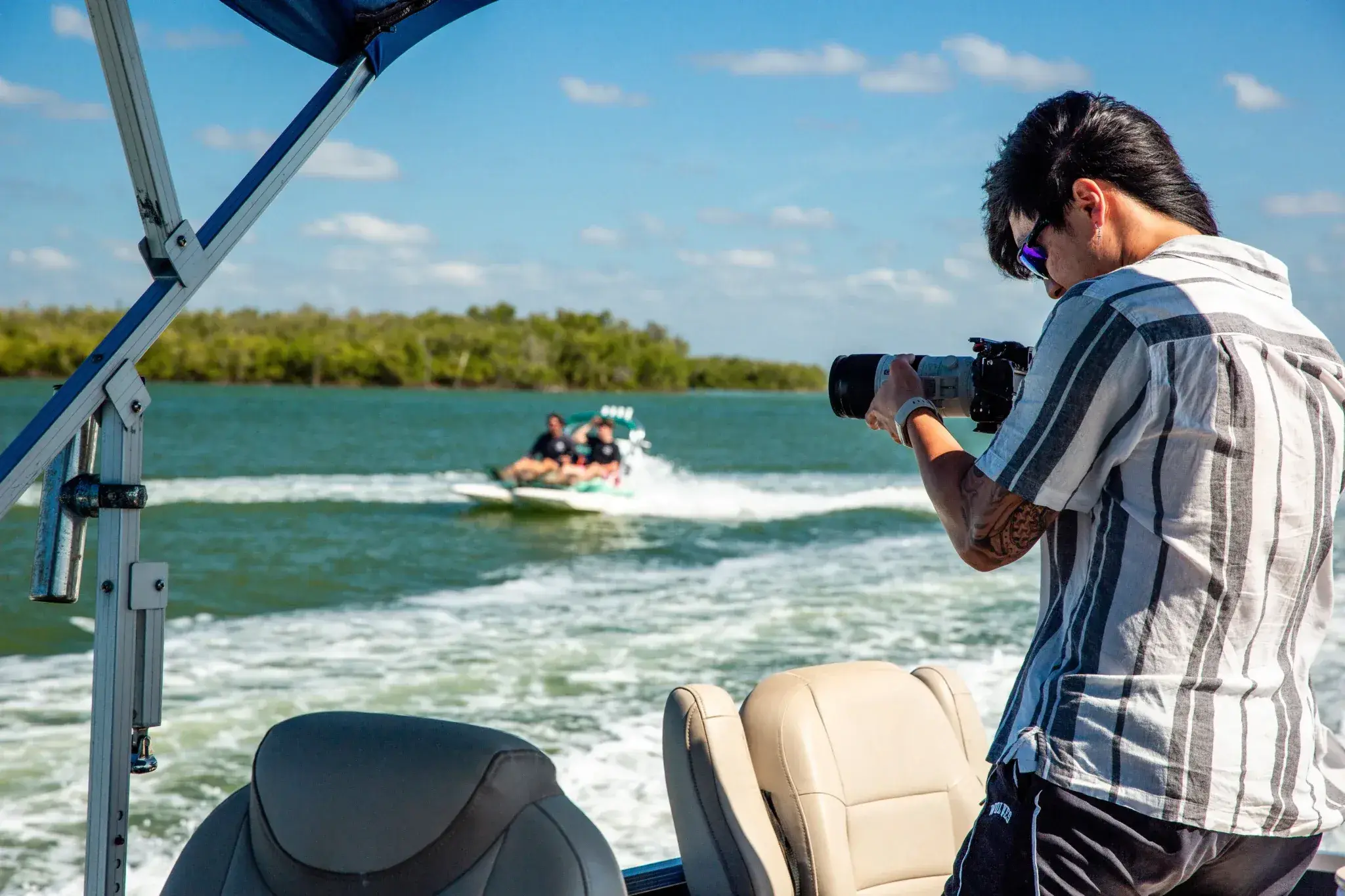 Photographer shooting from a boat on the water